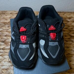 New Balance Kids Black and Gray Sneakers with Red Accents